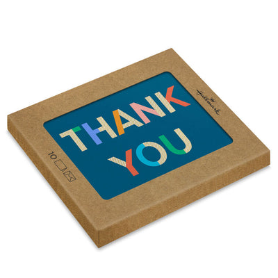 Colorblock thank-you cards with multicolor lettering on navy blue background and gold foil accents.
