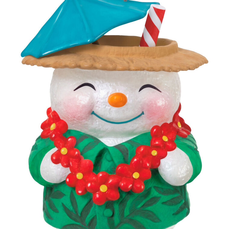 Snowman tiki drink ornament wearing green shirt and red lei with cocktail umbrella and striped straw, festive holiday decor

