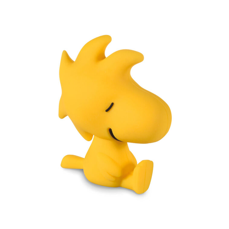 Yellow silicone drink charm shaped like Woodstock from Peanuts, designed to fit inside Charmers drinking glasses.

