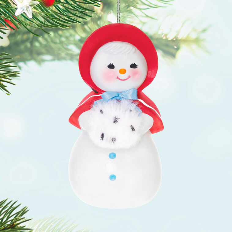 Hallmark Keepsake Sweet Snow Girl porcelain ornament, vintage snow lady with red bonnet, rosy cheeks, and fluffy scarf.