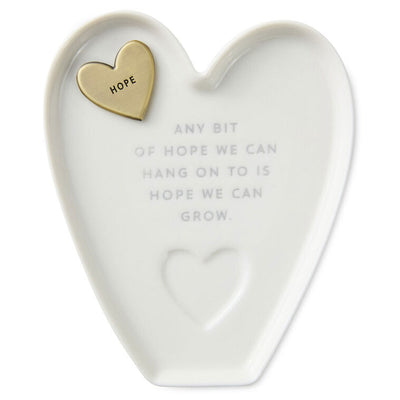 White heart-shaped Hallmark trinket dish with “Hope” engraved token and gray inspirational message.