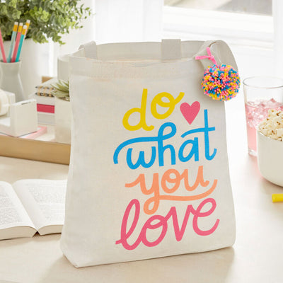 Hallmark 10.5-inch Do What You Love square fabric gift bag with retro lettering and pom-pom
