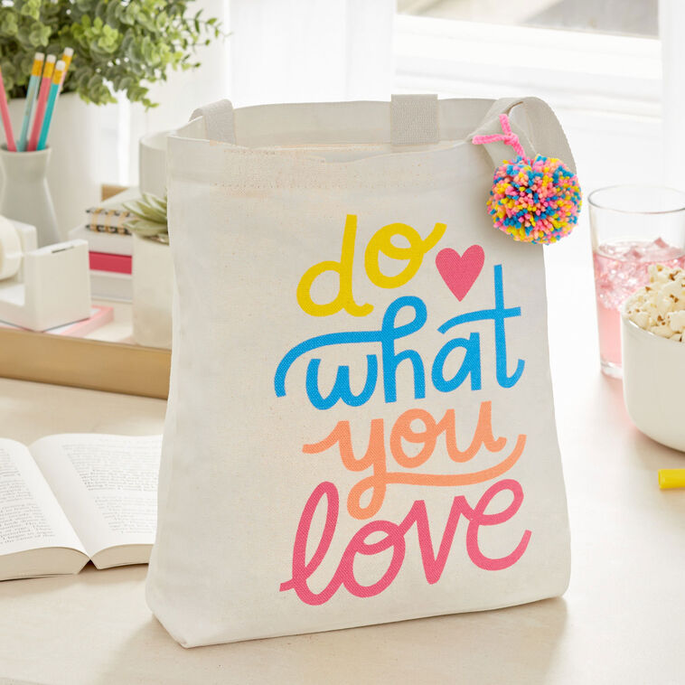 Hallmark 10.5-inch Do What You Love square fabric gift bag with retro lettering and pom-pom

