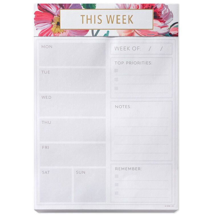 Floral weekly planner pad with gold foil accents and tear-off sheets for notes and scheduling.