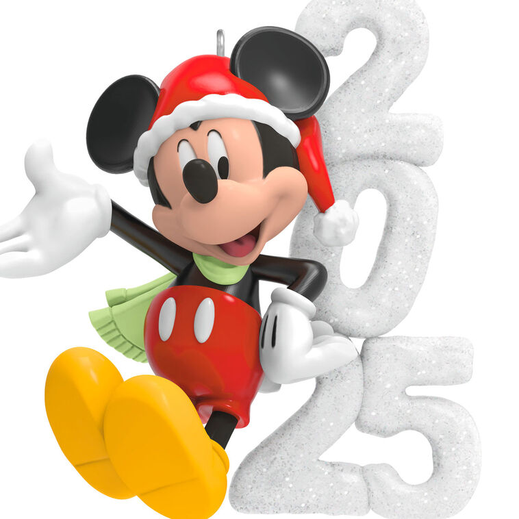 Mickey Mouse in Santa hat and scarf smiles next to a glittery “2025” snow sculpture in this festive Hallmark Keepsake Disney ornament.