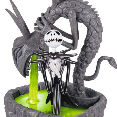 Jack Skellington in Halloween Town fountain ornament with glowing green light from The Nightmare Before Christmas.

