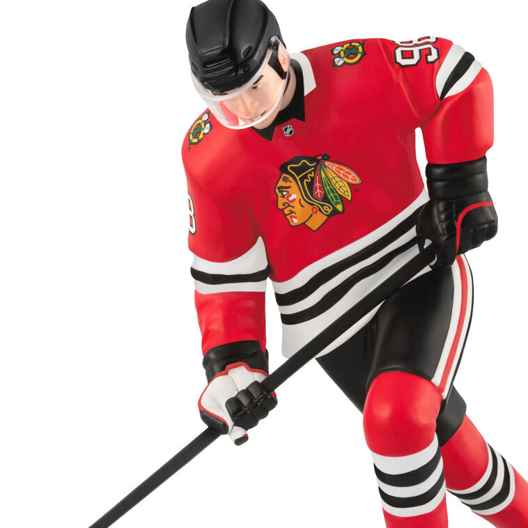 Connor Bedard ornament in Chicago Blackhawks jersey, number 98, action hockey pose, Hallmark NHL Christmas collectible for hockey fans
