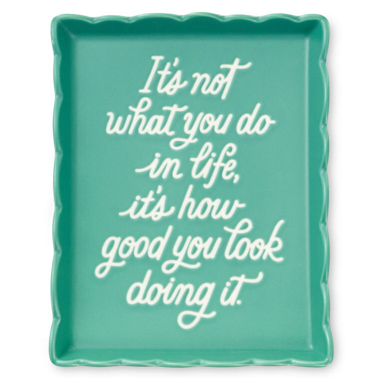 Teal Hallmark trinket tray with scalloped edge and message “It’s not what you do in life, it’s how good you look doing it.”