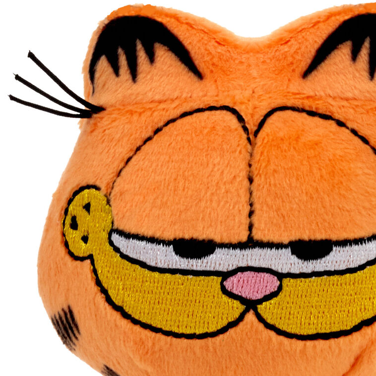 Garfield plush with orange fur, signature lazy expression, and love of lasagna.


