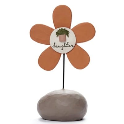 Resin figurine of a smiling flower with a long brown-haired stem shaped like a woman in a yellow dress