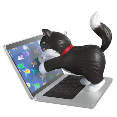 Hallmark Keepsake ornament of black-and-white tuxedo kitten playing with laptop showing colorful fish, Mischievous Kittens series