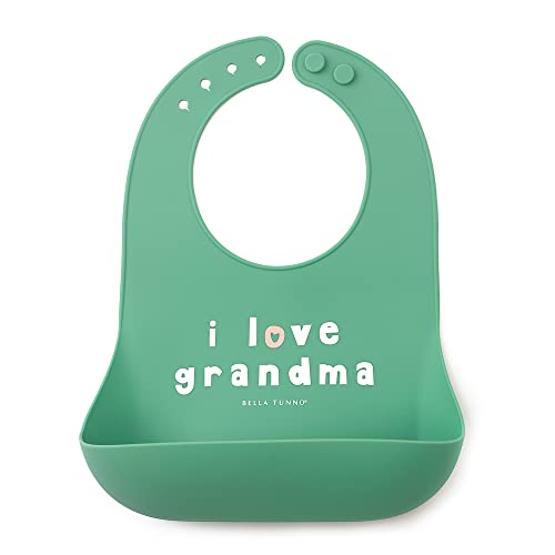 Pink silicone baby bib with “Love Grandma” phrase, features deep food-catching pocket and adjustable neck.

