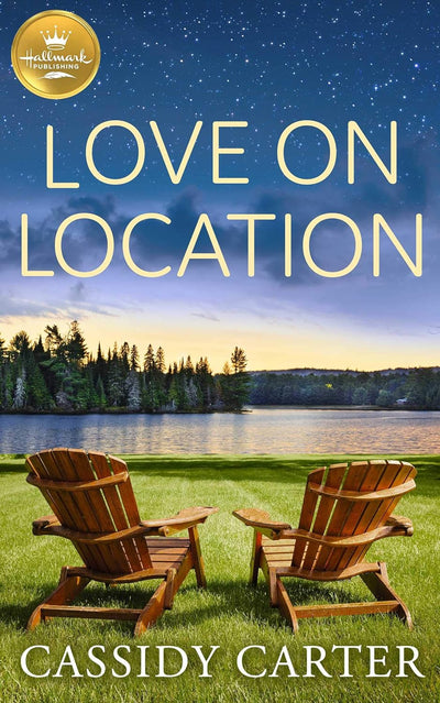 Cover of “Love on Location” by Cassidy Carter showing two chairs under a starry sky with cabin lights in the background.