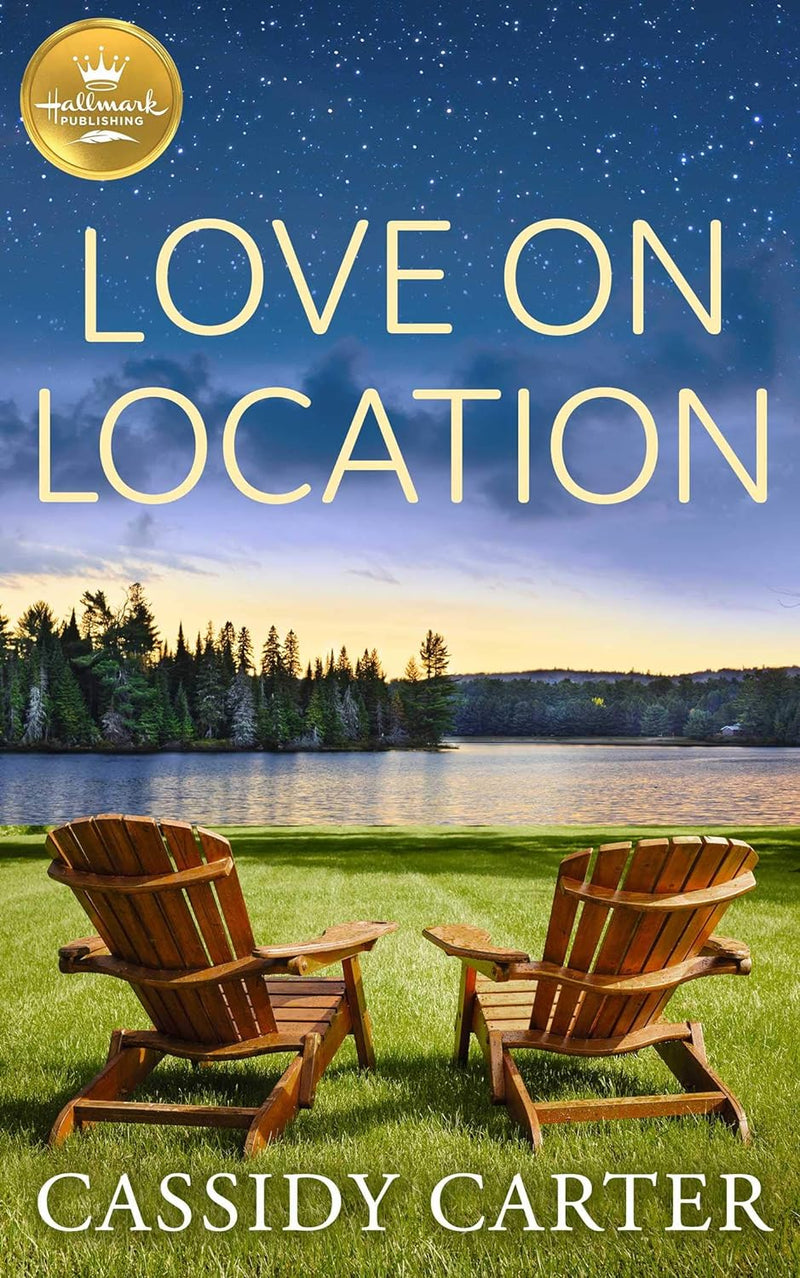 Cover of “Love on Location” by Cassidy Carter showing two chairs under a starry sky with cabin lights in the background.