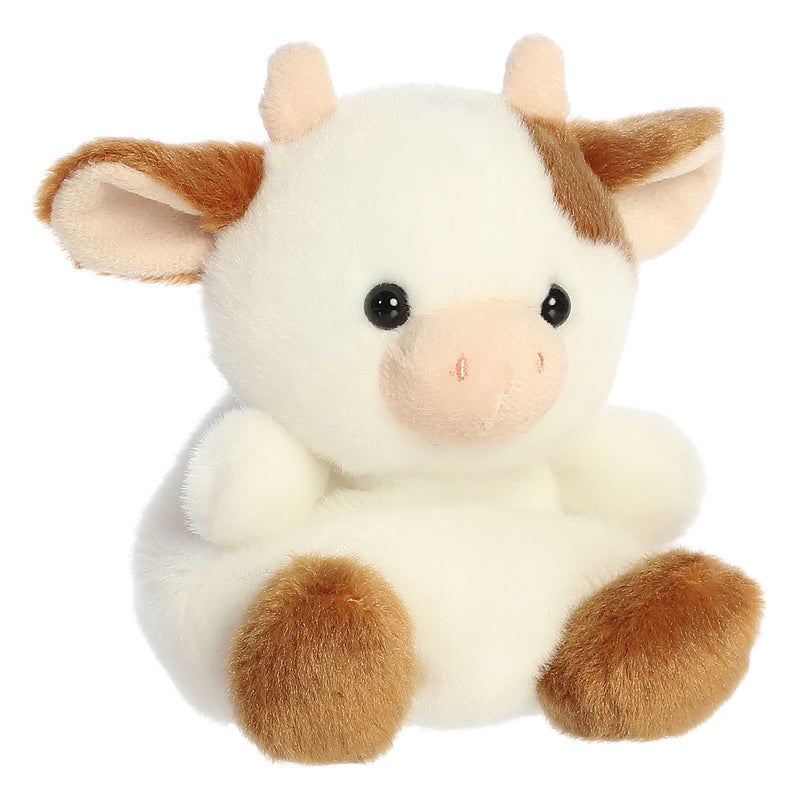 Caroline the brown cow Palm Pals plush with soft fur, white patches, and a bean-stuffed body sized perfectly for small hands.