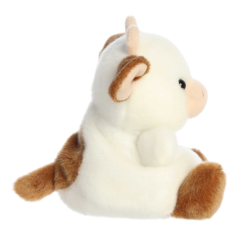 Caroline the brown cow Palm Pals plush with soft fur, white patches, and a bean-stuffed body sized perfectly for small hands.