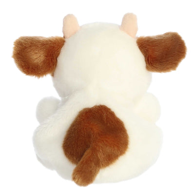 Caroline the brown cow Palm Pals plush with soft fur, white patches, and a bean-stuffed body sized perfectly for small hands.