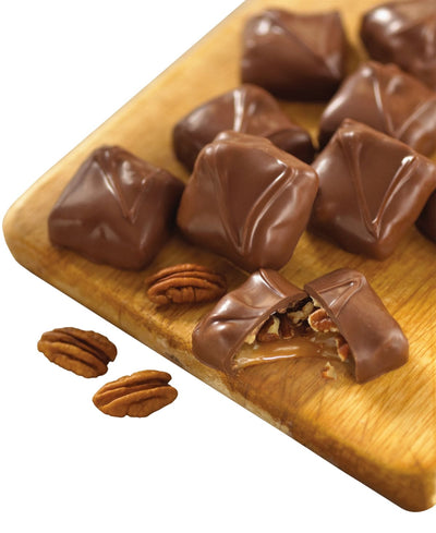 Box of Bissinger's chocolates with pecan pieces visible