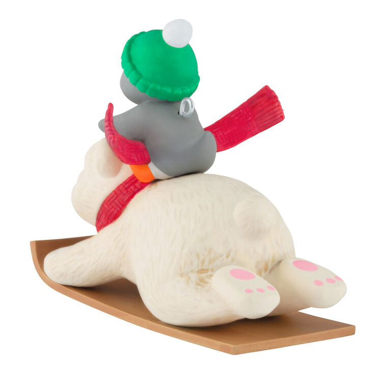 Tuxedo penguin in green hat rides Snowball the polar bear on toboggan, Hallmark Keepsake Christmas ornament