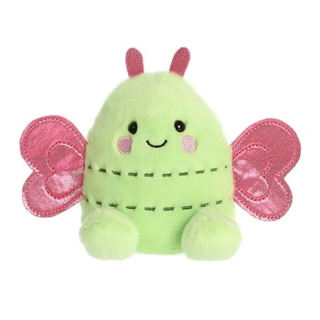A green plush toy pteranodon with pink wings