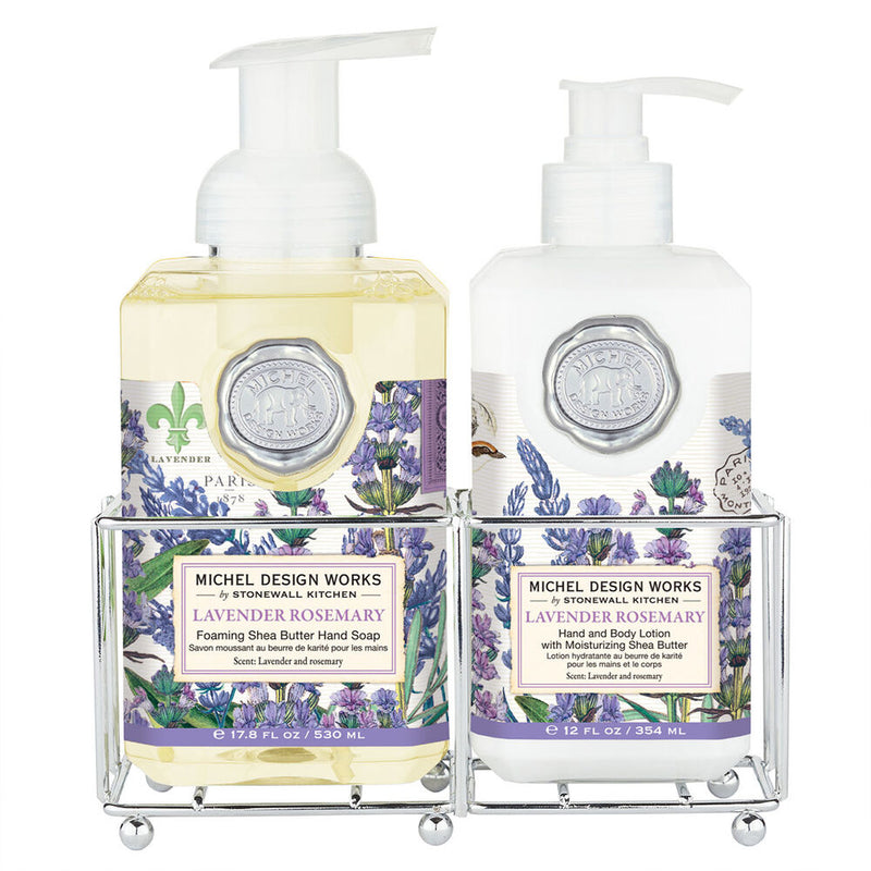 Michel Design Works Lavender Rosemary soap and lotion set in silver caddy with floral and herb-themed packaging.
