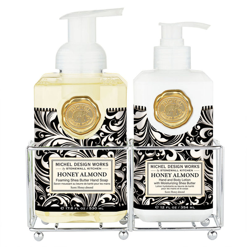 Michel Design Works Honey Almond soap and lotion set in silver caddy with elegant black and white packaging.
