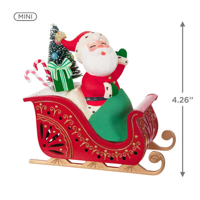 Vintage-style Santa in red sleigh with gifts and lighted base, part of ShowToppers musical tree topper system with synchronized effects.