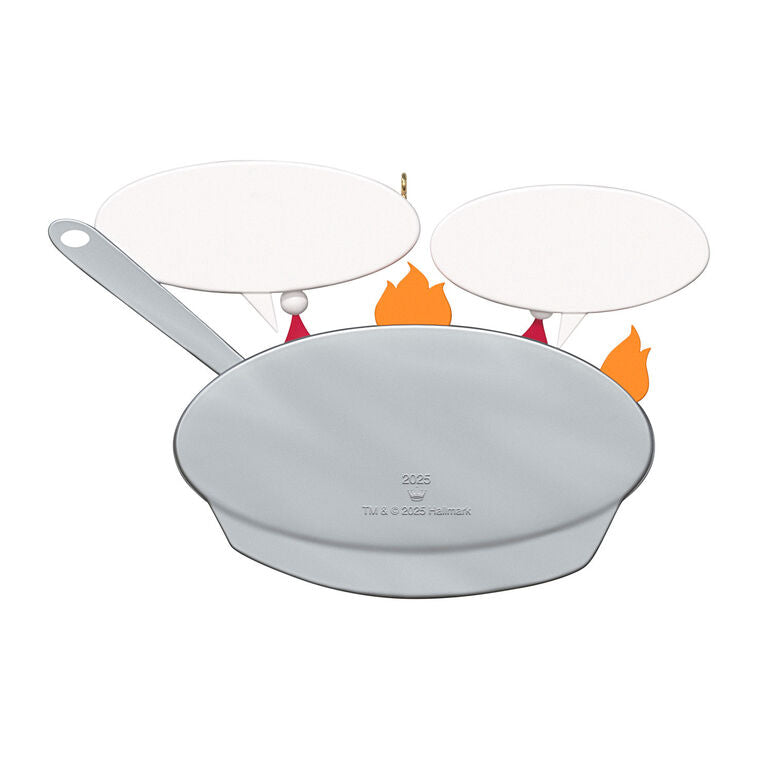 Funny Christmas ornament with two chestnuts roasting in a flaming skillet.

