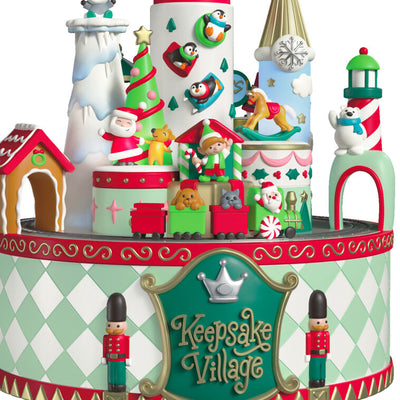 Musical Christmas village ornament with Santa, characters, spinning train, lights, and holiday carols, battery operated

