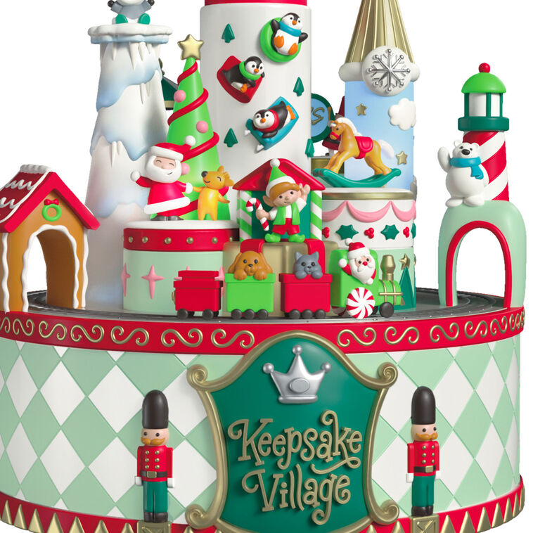 Musical Christmas village ornament with Santa, characters, spinning train, lights, and holiday carols, battery operated

