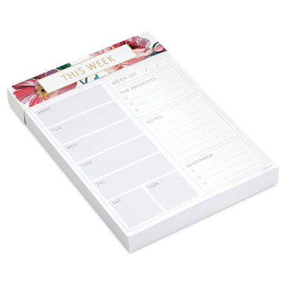 Floral weekly planner pad with gold foil accents and tear-off sheets for notes and scheduling.