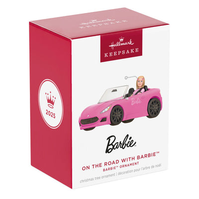 Barbie ornament driving a pink convertible sports car, wearing pink tee and barrettes, Hallmark Keepsake holiday decoration.