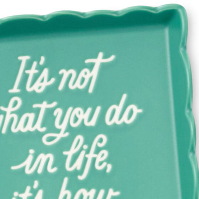 Teal Hallmark trinket tray with scalloped edge and message “It’s not what you do in life, it’s how good you look doing it.”