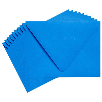 Bold royal blue envelopes with abstract multicolor shapes inside the flap and pointed flap design.
