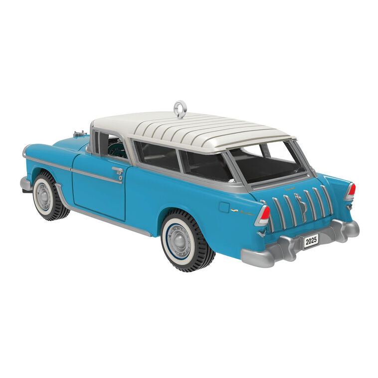 Miniature 1955 Chevrolet Nomad Wagon Christmas ornament in blue and white, featuring vintage styling, turning wheels, and silver accents.
