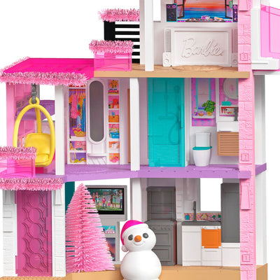 Barbie Dreamhouse ornament, three-story pink house with rooftop studio, Christmas lights, and snowman, Hallmark Keepsake musical decoration.

