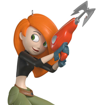 Kim Possible ornament in black top and green pants, holding grappling hook with Rufus the naked mole rat by her side.

