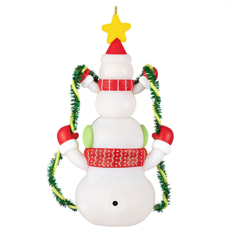 Stacked snowmen Christmas ornament wrapped in green tinsel garland with glowing star, battery operated light-up decor

