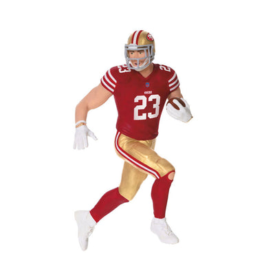 Christian McCaffrey ornament in 49ers red and gold uniform, number 23, action pose with football, Hallmark NFL Christmas collectible