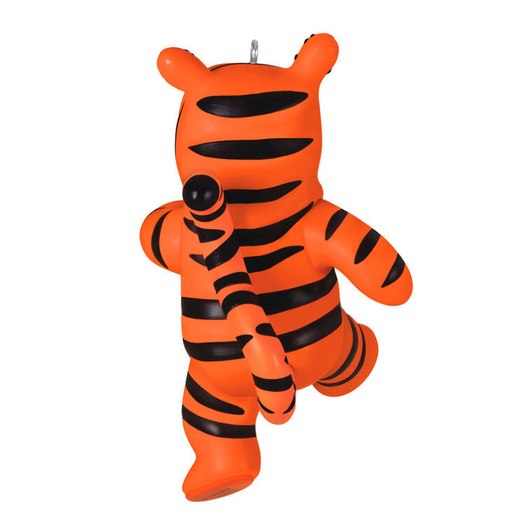 Winnie the Pooh ornament dressed in a striped orange Tigger costume with hood and bouncing pose