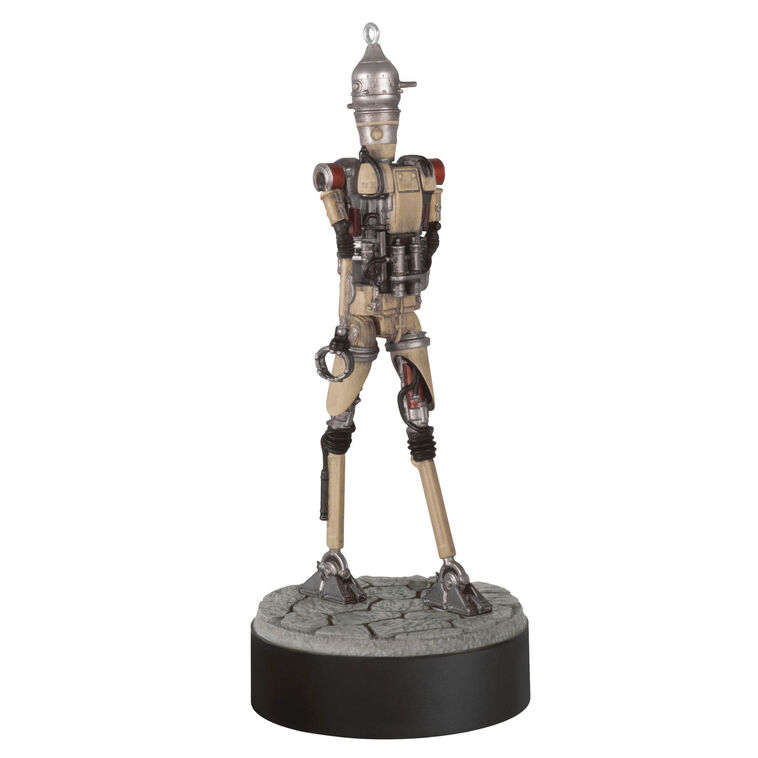 Ornament of Grogu piloting IG-12 droid from Star Wars: The Mandalorian™, on round base with sound button for “Yes” and “No” phrases.