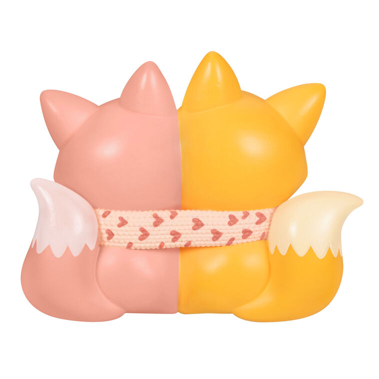 2025 Christmas ornament with two foxes snuggled in a heart-patterned scarf, celebrating sisterly love

