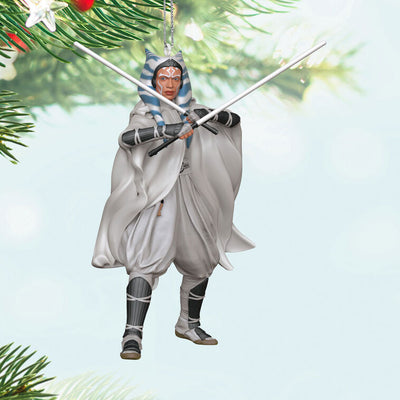 Ahsoka Tano ornament in gray cloak with dual white lightsabers drawn, posed for battle as seen in Star Wars: Ahsoka.