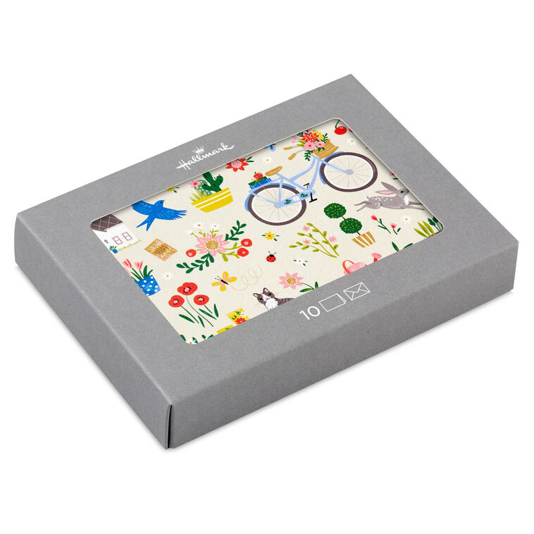 Garden-themed blank note cards with flowers, bike, and house illustrations on white background, 10-pack with envelopes and matte finish.

