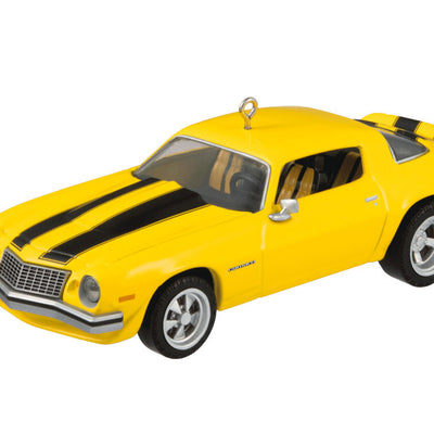 Yellow and black 1976 Chevrolet Camaro ornament from Transformers with turning wheels, representing Bumblebee in Earth vehicle disguise.