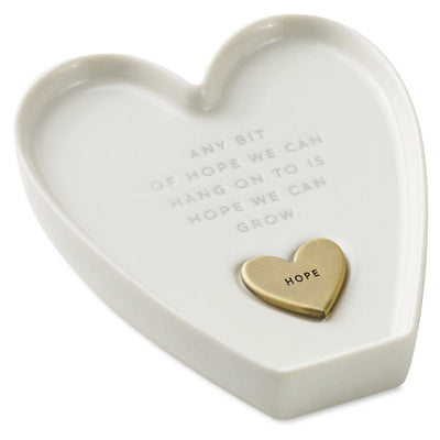 White heart-shaped Hallmark trinket dish with “Hope” engraved token and gray inspirational message.