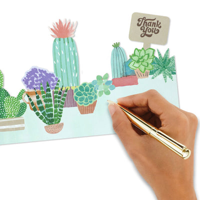 Die-cut thank-you cards with fold-out illustrated potted succulents and cacti in display-ready shapes.
