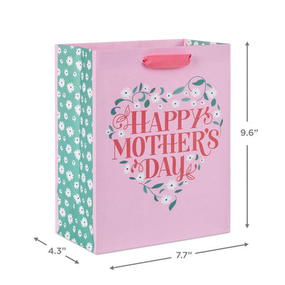 Hallmark medium pink gift bag with floral heart design, green vine, white flowers, and Happy Mother's Day message in red