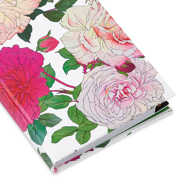 Password keeper book with fuchsia and cream floral cover, alphabetical tabs, and striped end sheets.