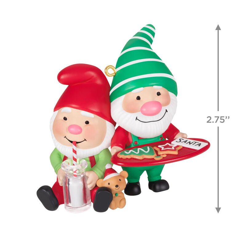 Hallmark Keepsake Gnome for Christmas ornament—two gnomes in red and green hats and overalls, with cookies for Santa and mug of milk, festive scene
